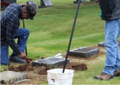 crew working to raise a marker